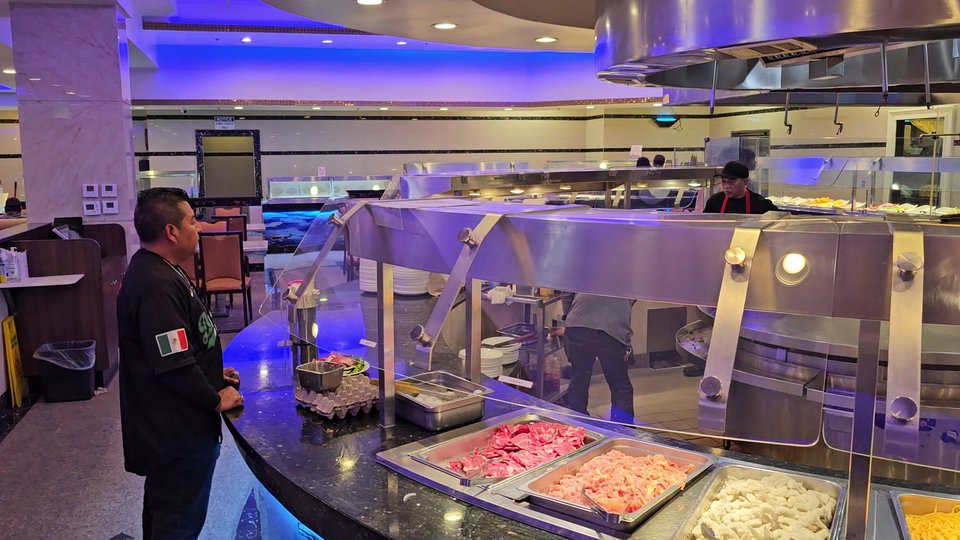Sushi and grilled items on a buffet line